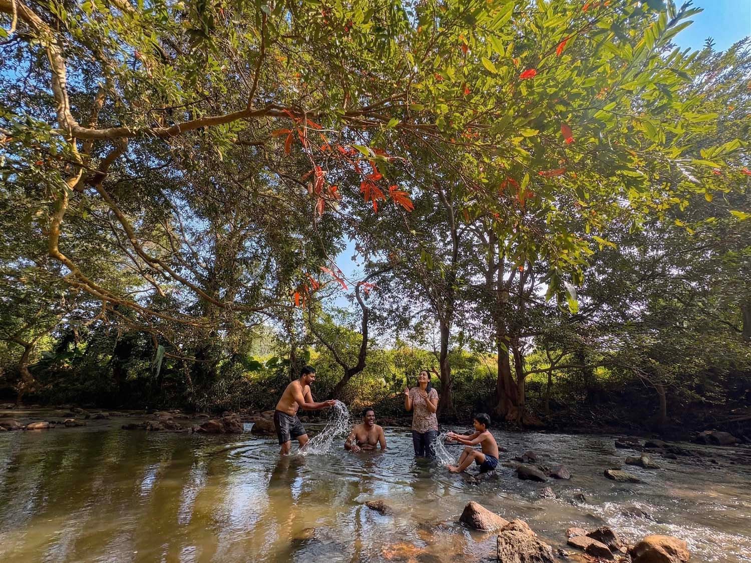 Family enjoying river bathing experience